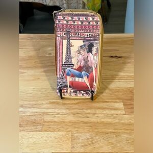 Lady Eiffel Tower background graphic print wallet zip around wrislet strap